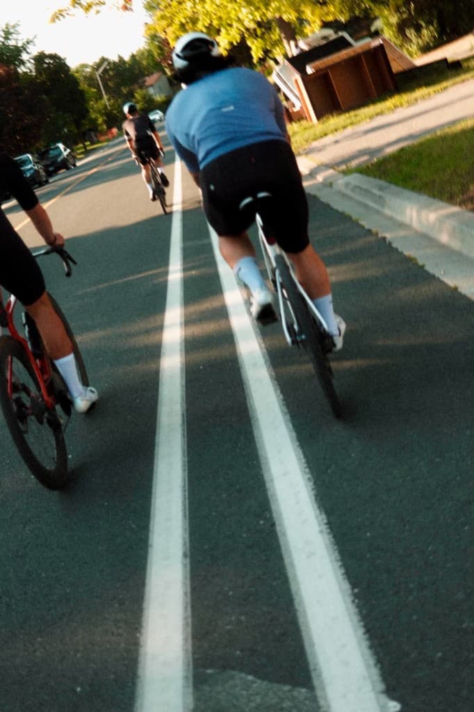 A rider on an open road at golden hour